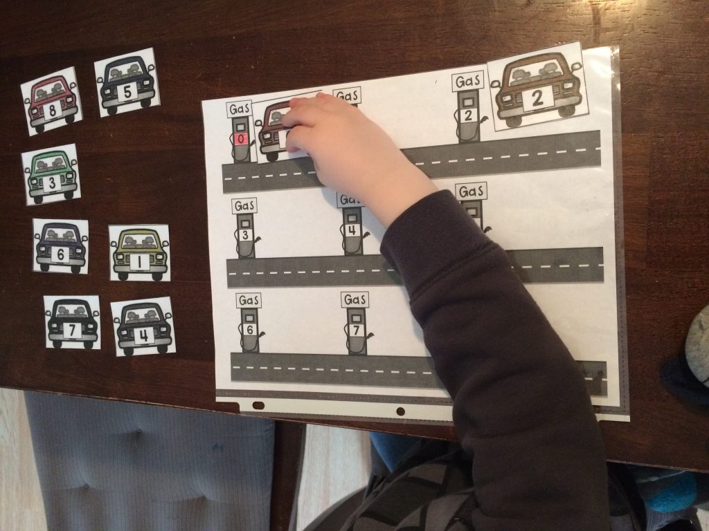 Preschooler Playing Learning Game with Cars